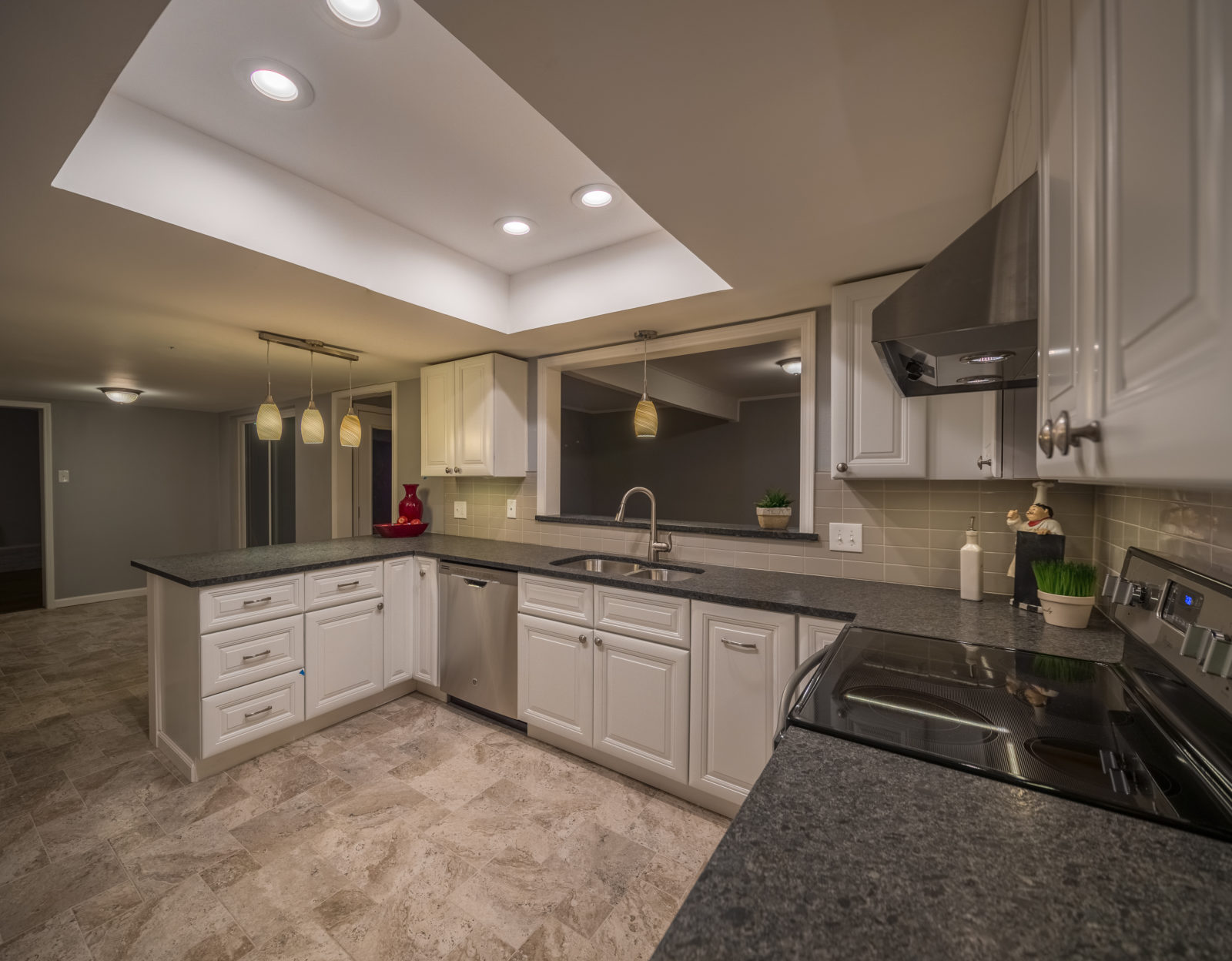 Complete-Modern-Kitchen-Redesign-White-Painted-Cabinets-Dark-Granite-Countertop